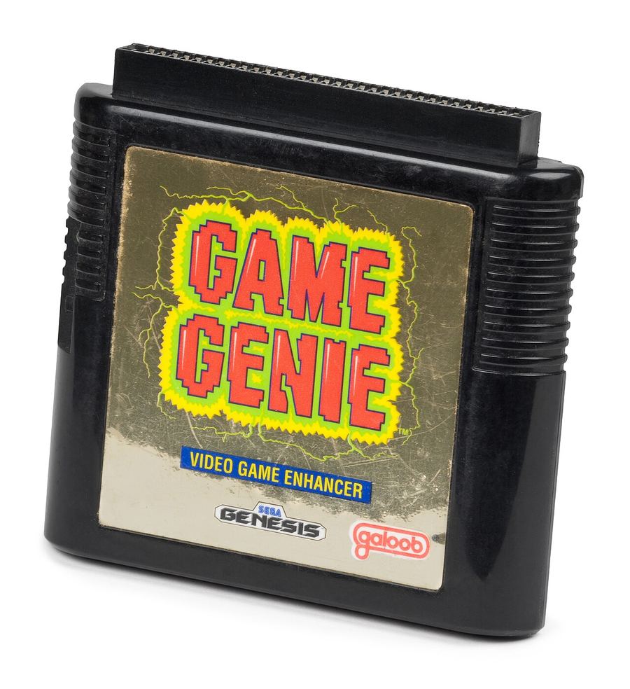 A Game Genie for the Sega Genesis, a black cartridge-shaped pass-through device