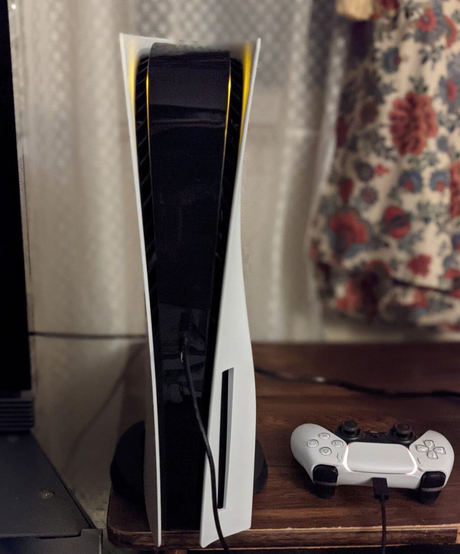 A PlayStation 5 console with its controller